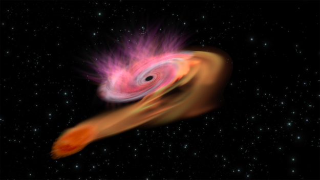 Artist's impression of the supermassive black hole at the centre of a galaxy accreting mass from a star that dared to venture too close to the galaxy's centre. This phenomenon is known as a tidal disruption event.