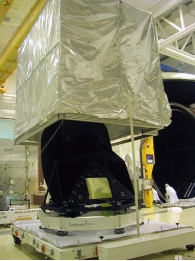 The telescope frame being unpacked from its shipping container. Image courtesy of and © 2004 Alcatel Space.